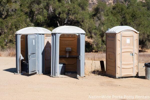 a clean row of portable restrooms for outdoor weddings or festivals in Iowa